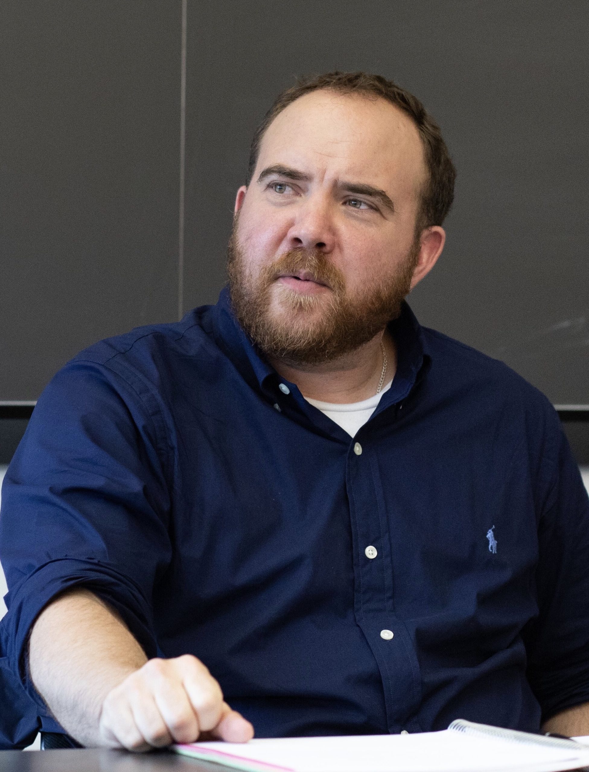 Photo of Blake Francis during class. He is wearing a blue shirt.